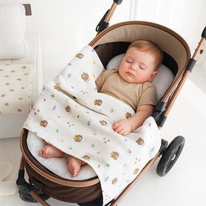 Bébé fait un petit dodo dans sa poussette avec sa Couverture bébé