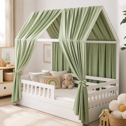 ciel de lit vert placé sur le lit